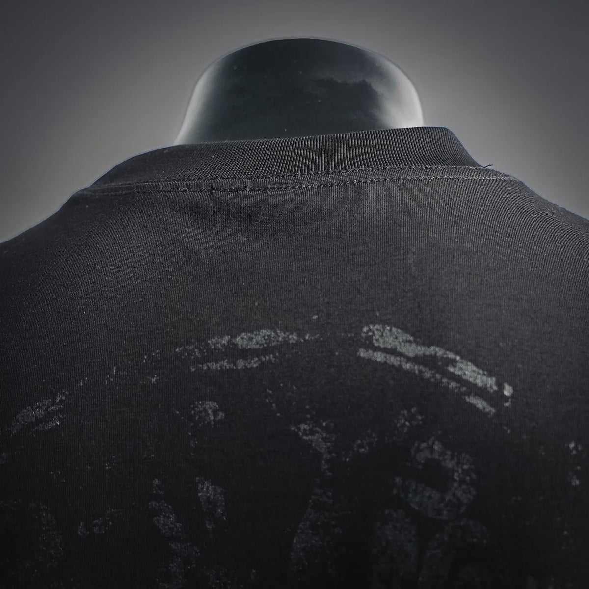 Stussy black T-shirt back collar and upper print detail