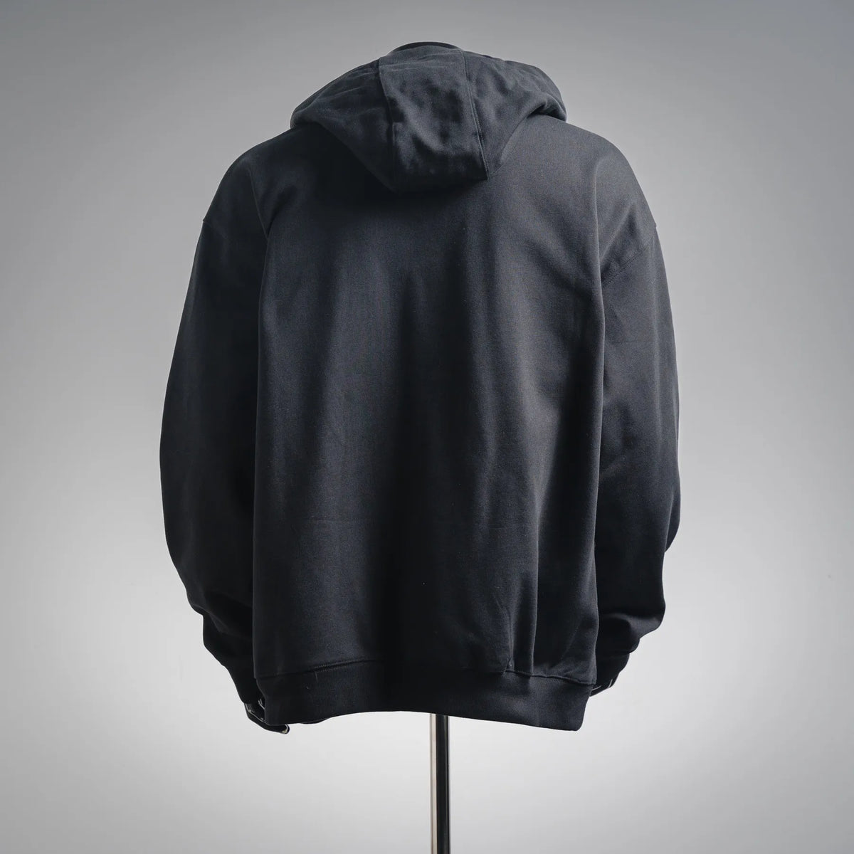 Black zip-up hoodie with attached hood, back view