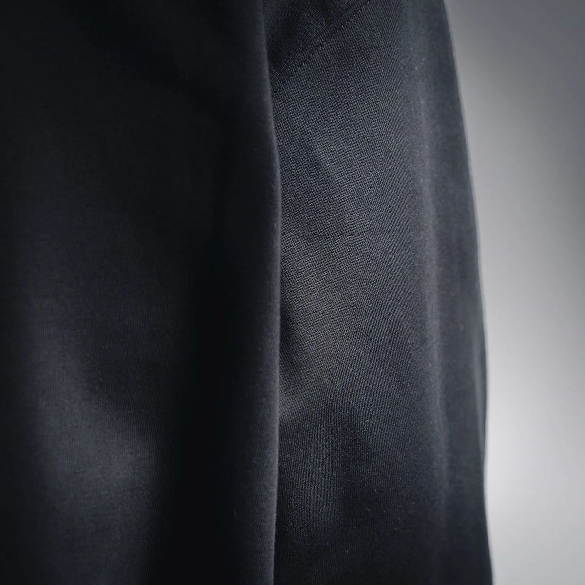 Black hoodie side fabric texture close-up