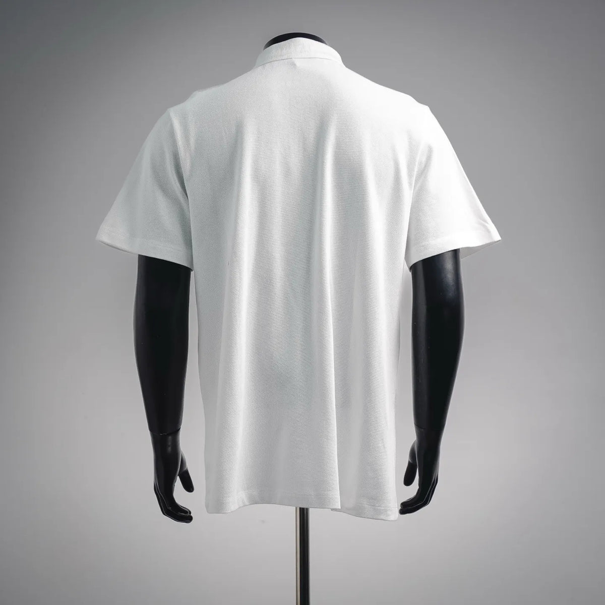 White polo shirt, back view with short sleeves and smooth collar