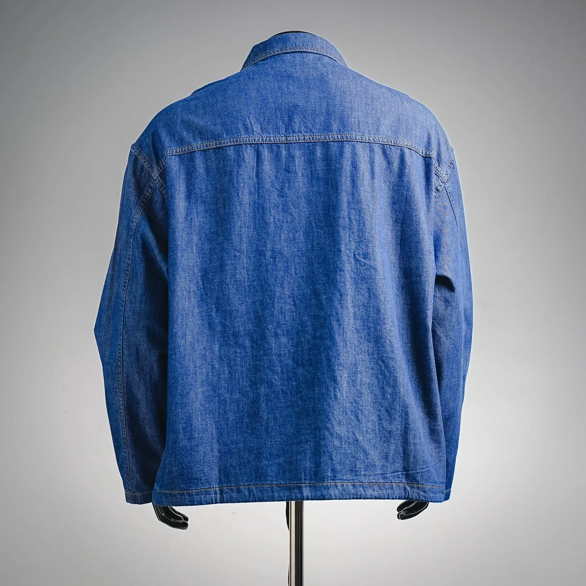 Denim zip jacket back view with yoke seam and stitched collar