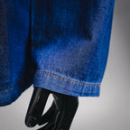 Denim jacket sleeve hem with orange stitch detail