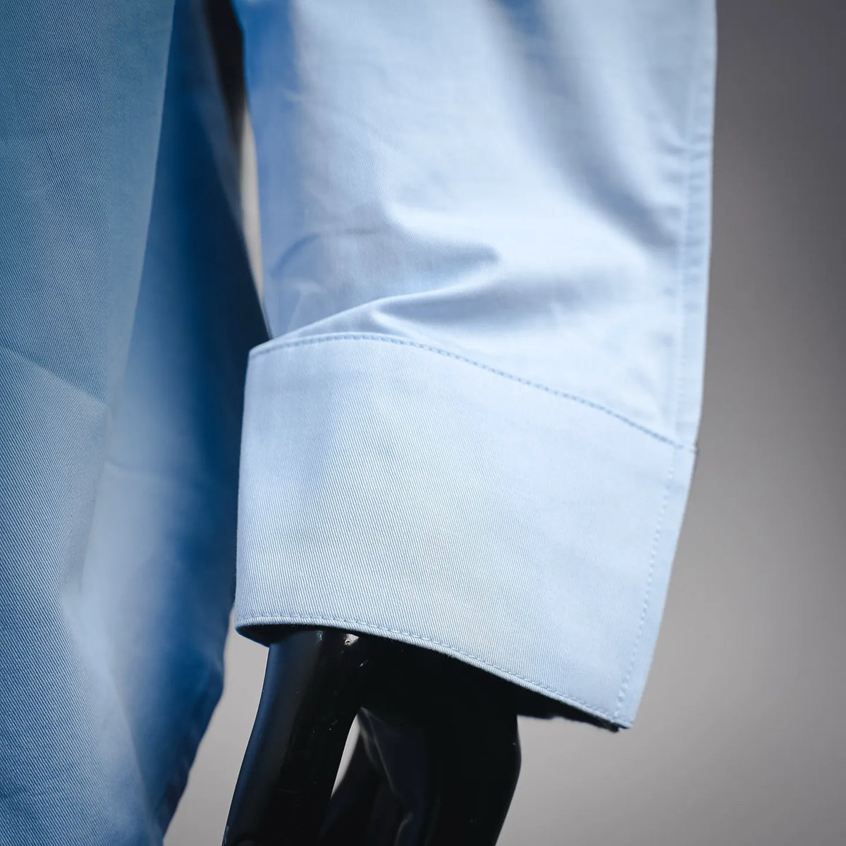Light blue shirt sleeve cuff with neat single-button placket detail