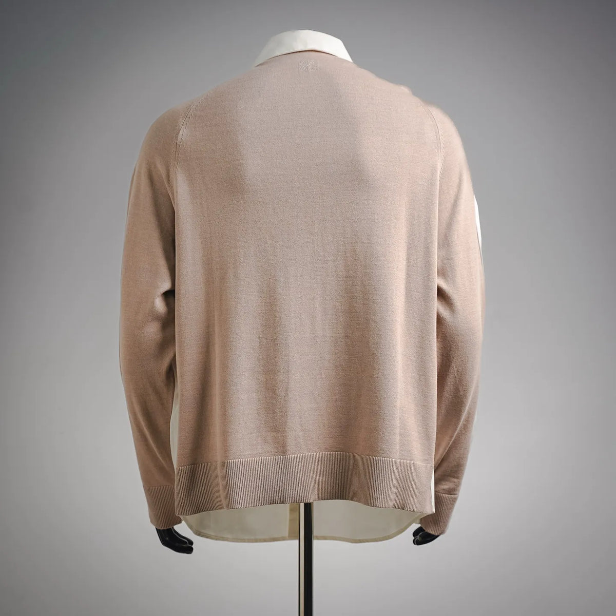 Beige knit long-sleeve pullover top on mannequin, back view with crew neck