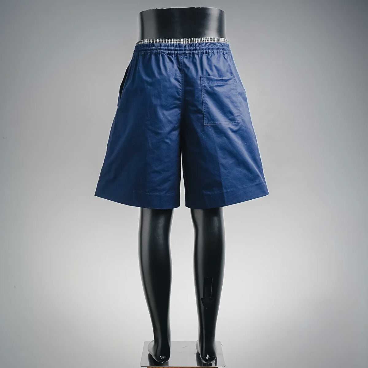 Blue drawstring shorts with elastic waistband, front view on mannequin