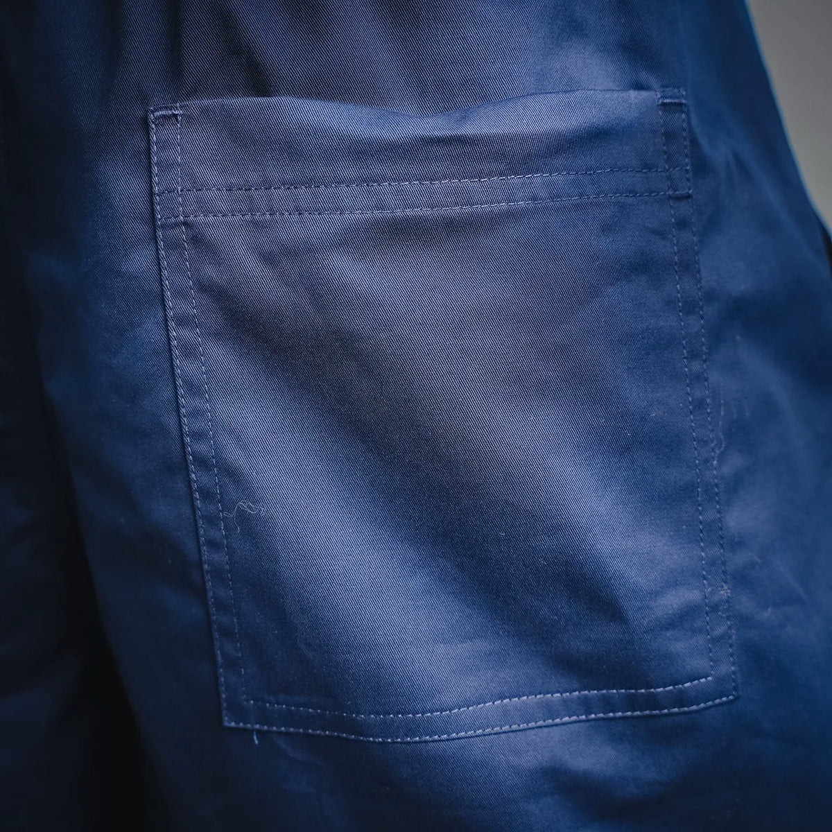 Blue shorts front pocket with visible stitched edge