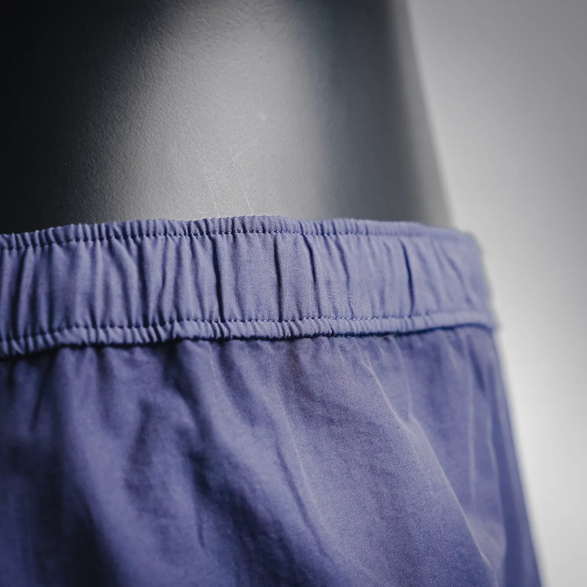 Dark blue elastic waistband with gathered seam detail
