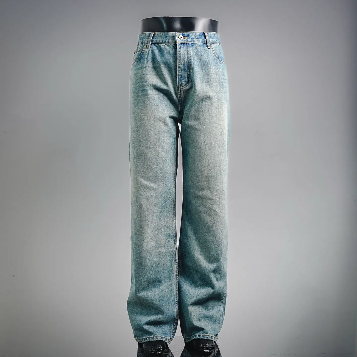 Light blue denim pants with button fly and straight legs