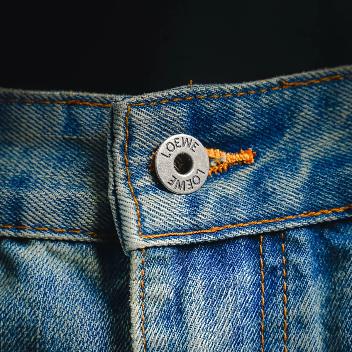 LOEWE engraved button at waistband with orange contrast stitching