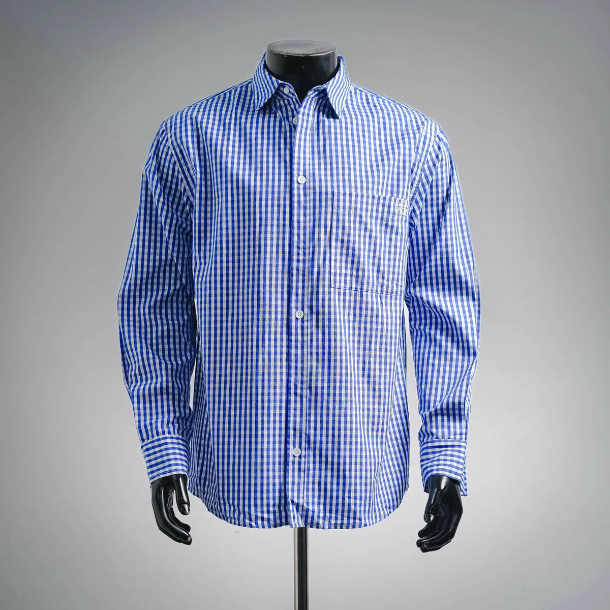 Blue and white check long-sleeve button-up shirt on mannequin.