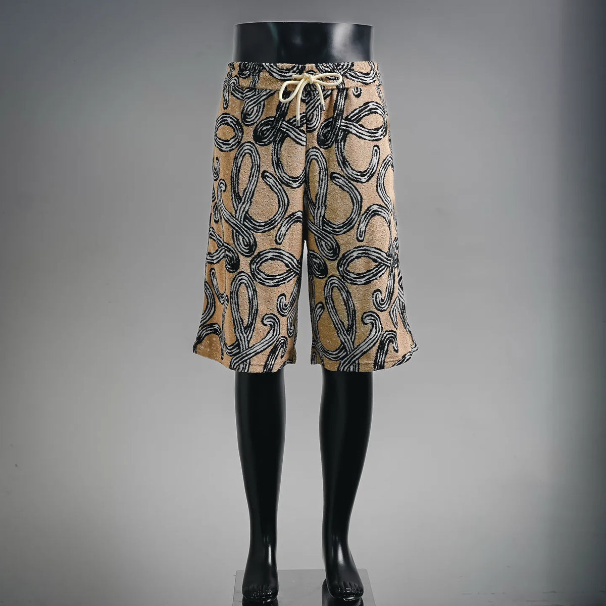 LOEWE drawstring shorts with tan and black abstract pattern