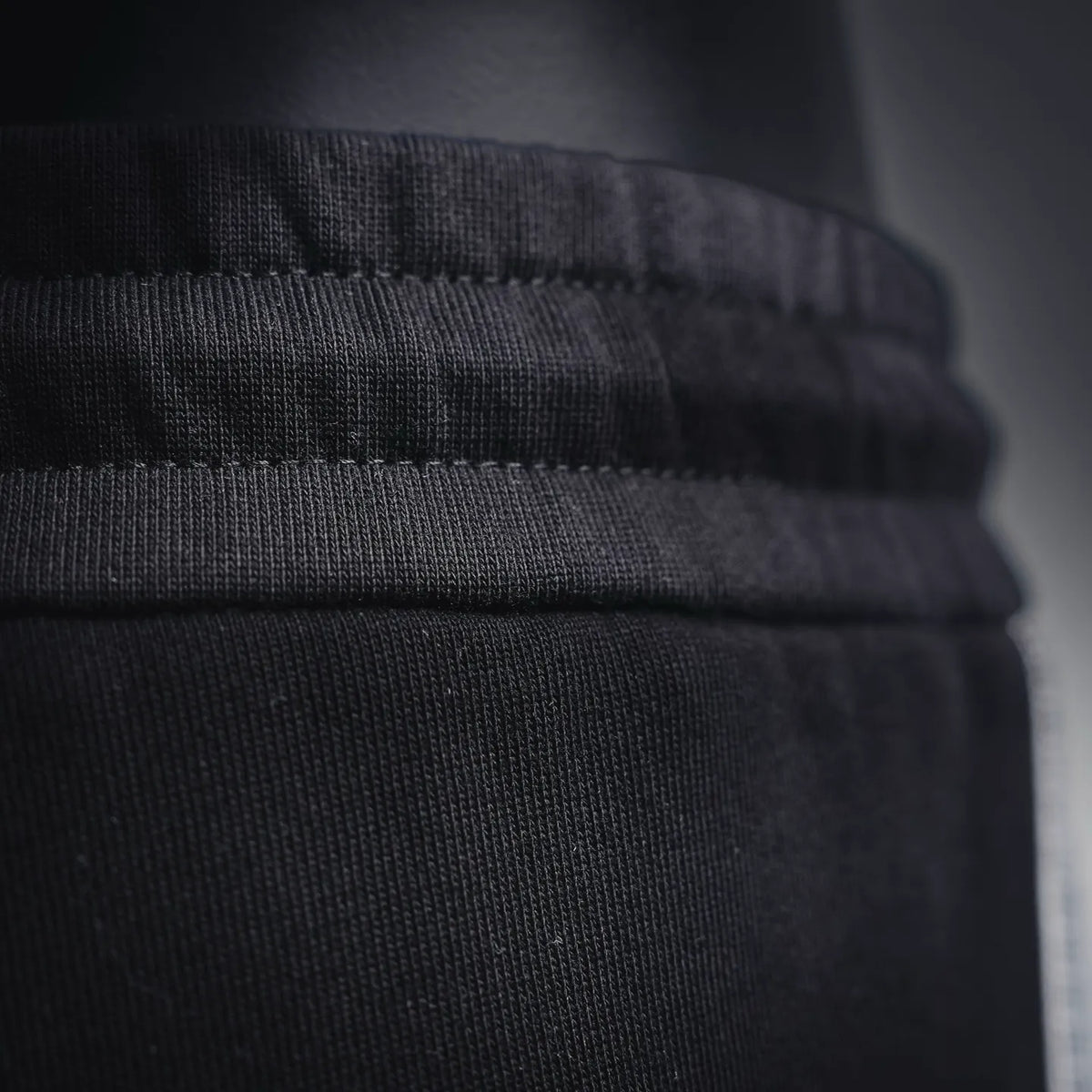 LOEWE black shorts hem close-up with ribbed cuff and stitching