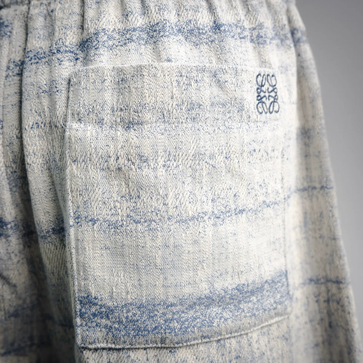 LOEWE light blue striped shorts with textured woven fabric