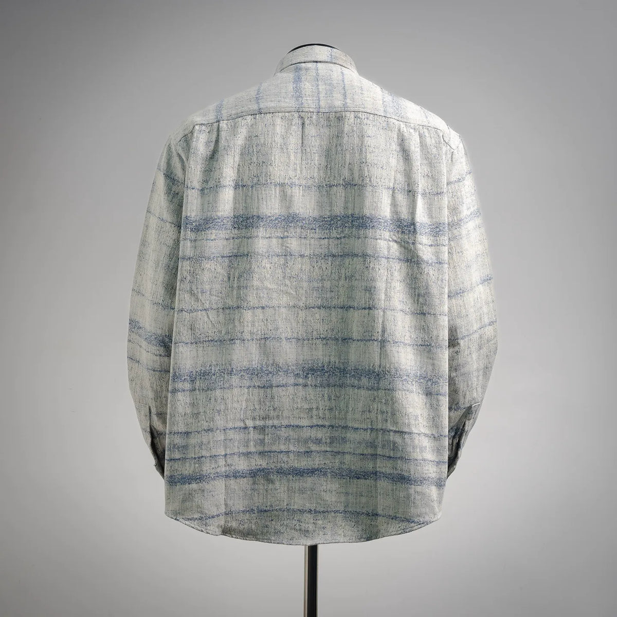 Long-sleeve button-up shirt in light blue and white plaid, shown from the back