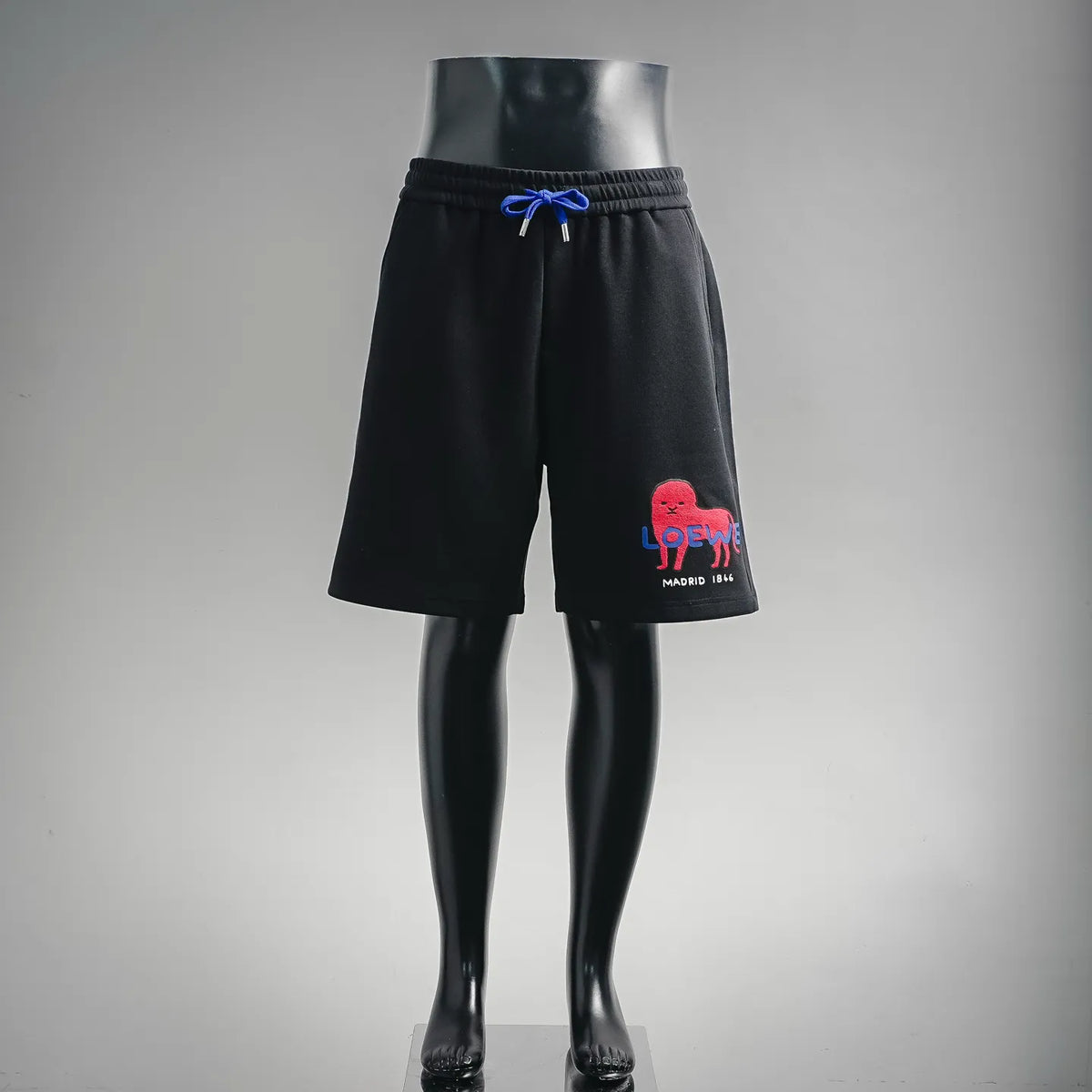Black LOEWE drawstring shorts with blue logo on front leg