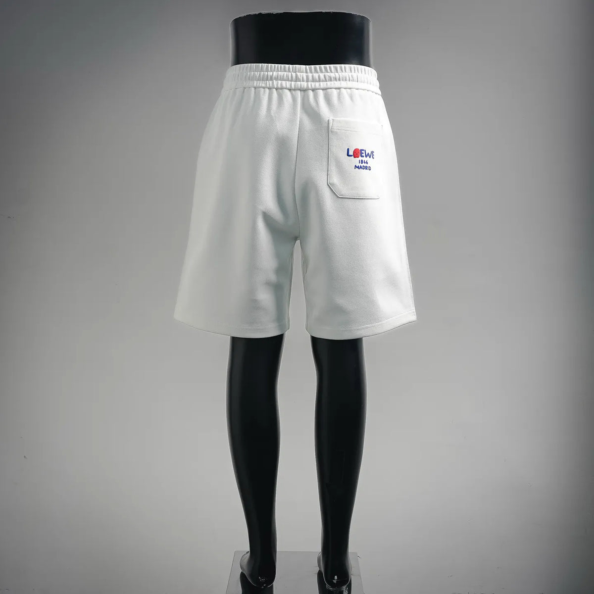 White LOEWE shorts with back pocket and small LOEWE logo patch
