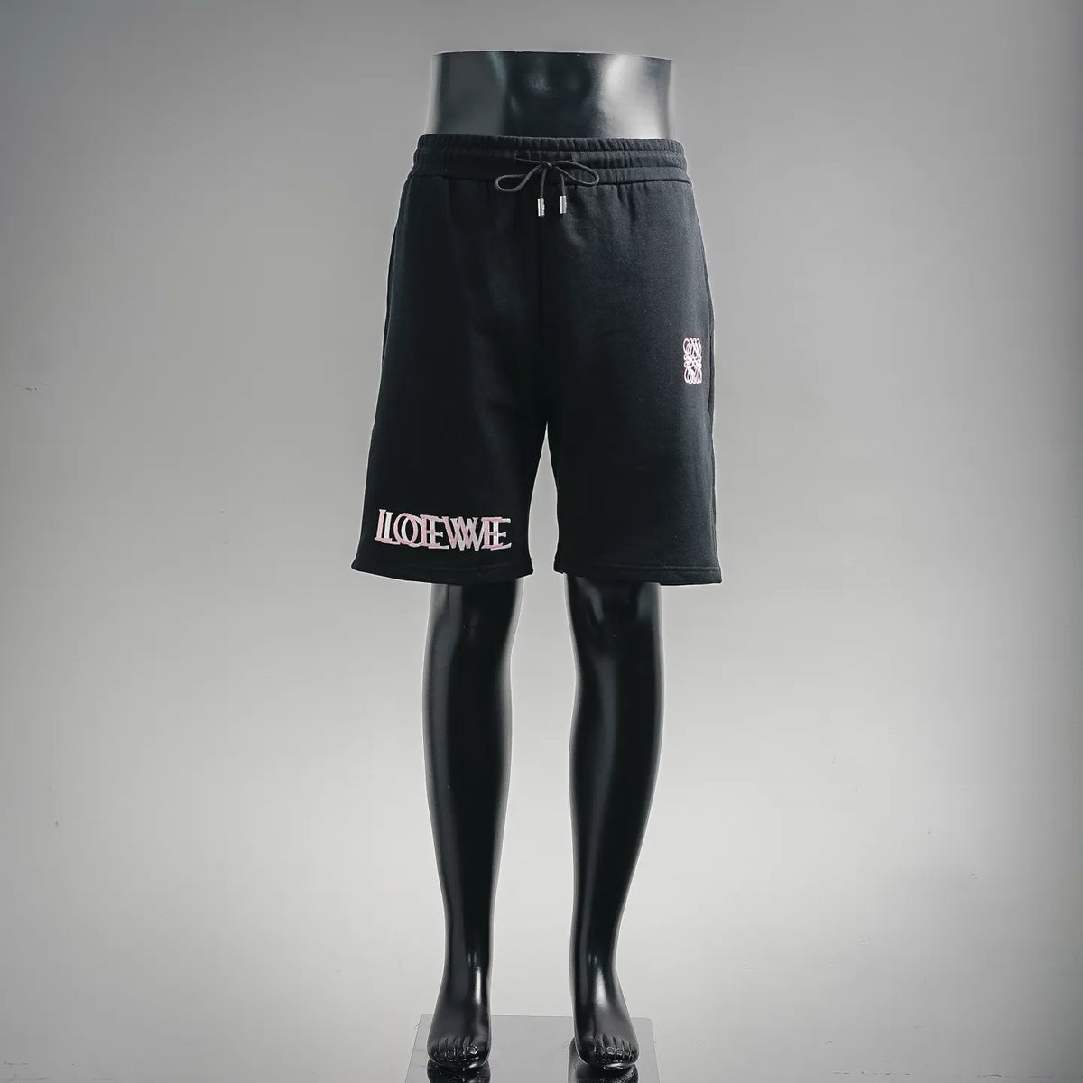 Black LOEWE logo drawstring shorts with elastic waistband and knee-length cut