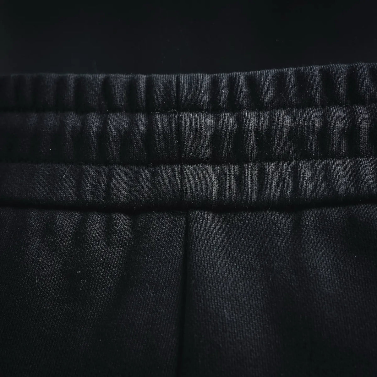Black drawstring shorts waistband with ribbed elastic detail