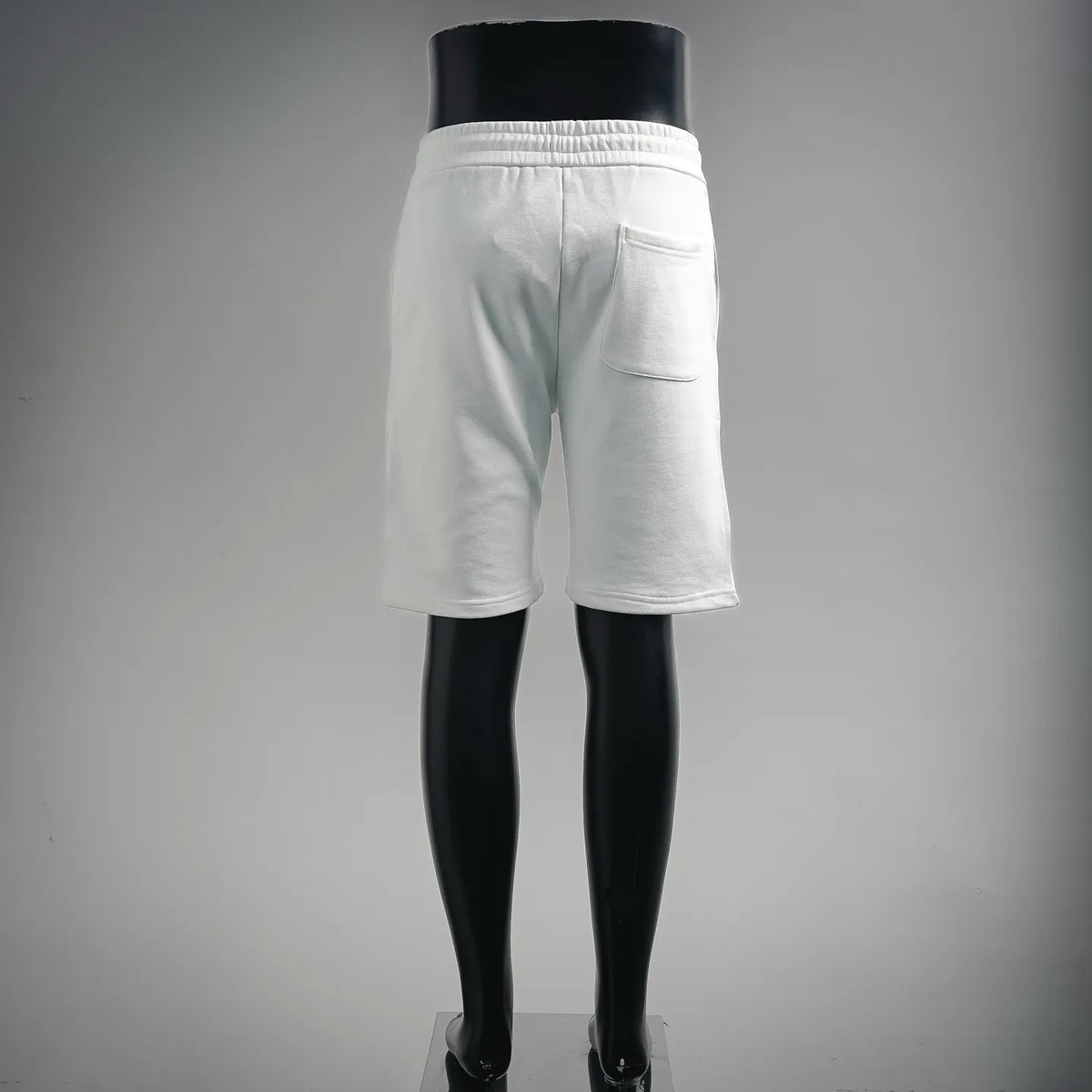 White drawstring shorts with back view, elastic waistband, side pocket