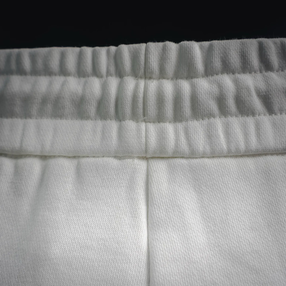 White shorts waistband with elastic band and gathered fabric