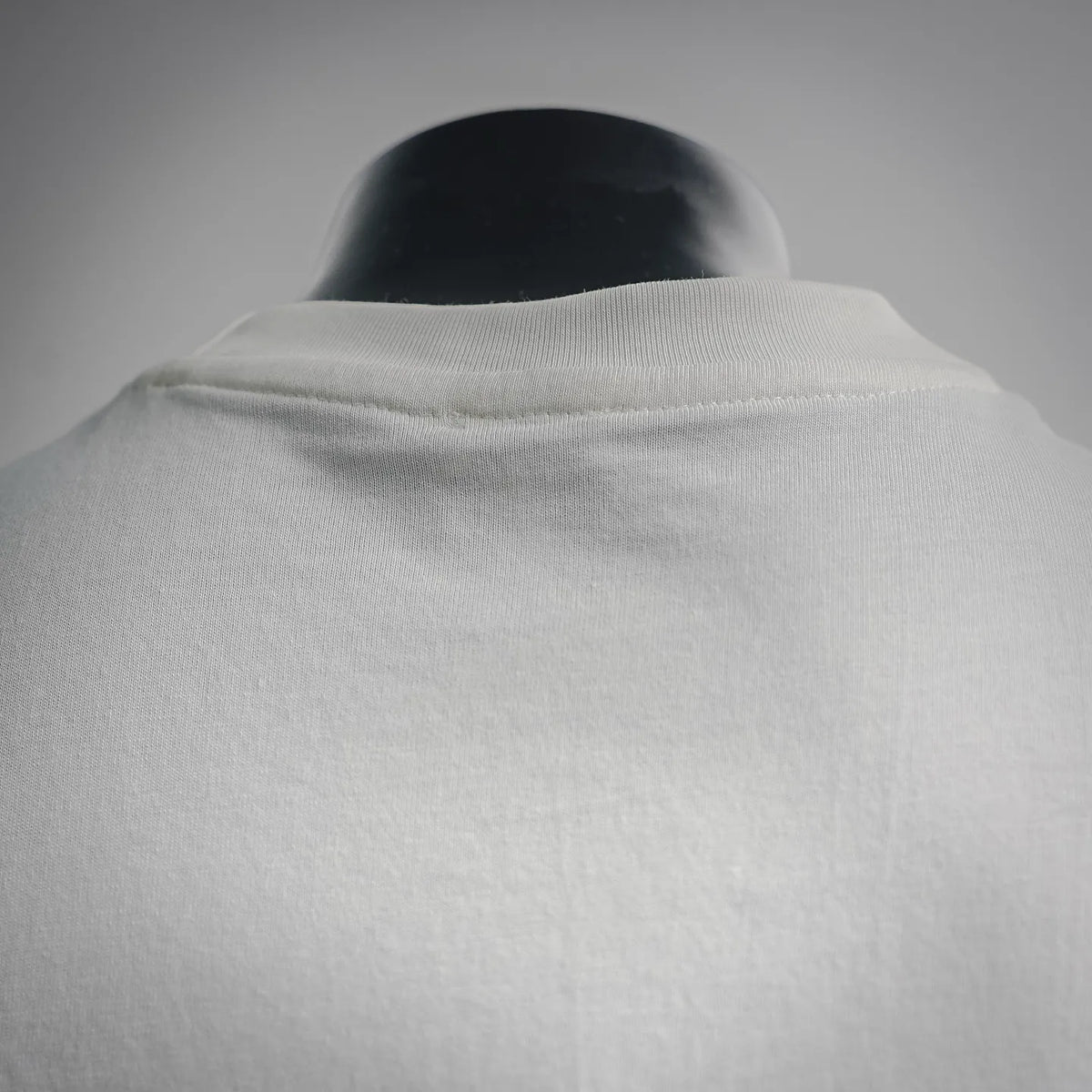 White T-shirt back yoke with crew-neck seam detail