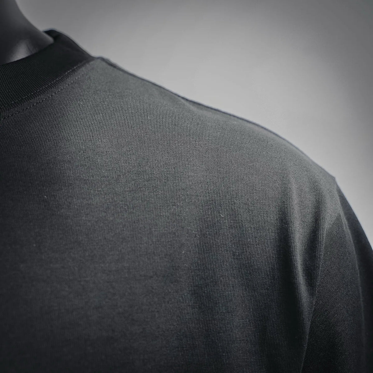 LOEWE black T-shirt fabric and shoulder seam close-up