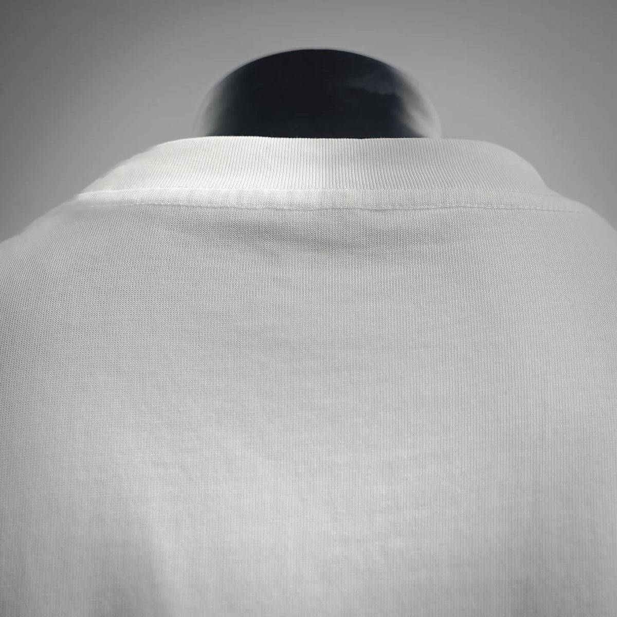 White ribbed crew neck collar on short-sleeve T-shirt