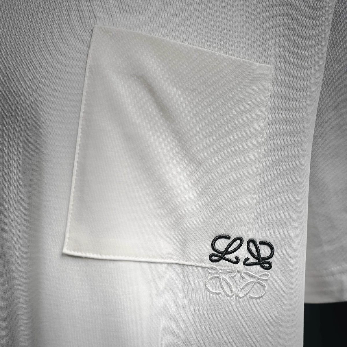White chest pocket with black LOEWE logo embroidery
