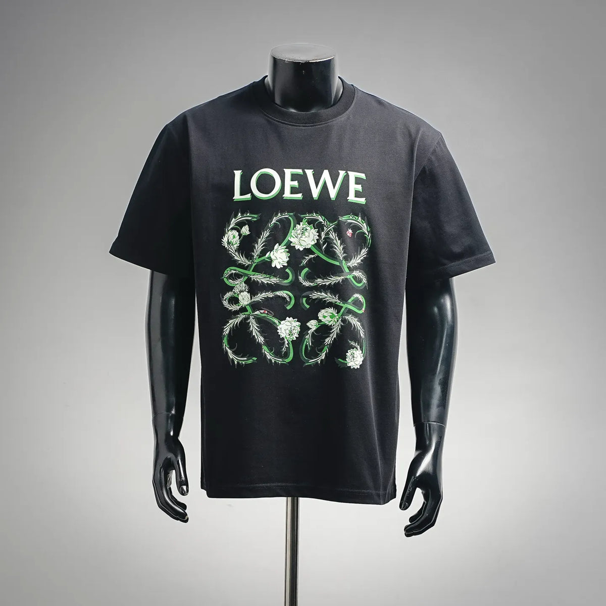 Black LOEWE T-shirt with green floral graphic and logo print on the front