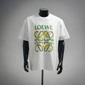 White LOEWE T-shirt with colorful garden crest graphic on chest.