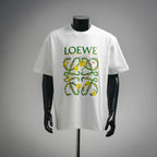 White LOEWE T-shirt with colorful garden crest graphic on chest.