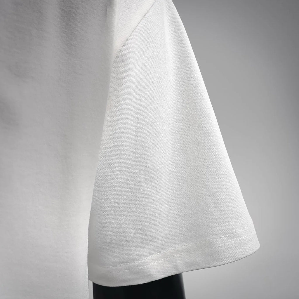 White LOEWE short-sleeve T-shirt hem and side seam detail.