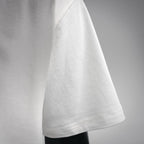 White LOEWE short-sleeve T-shirt hem and side seam detail.