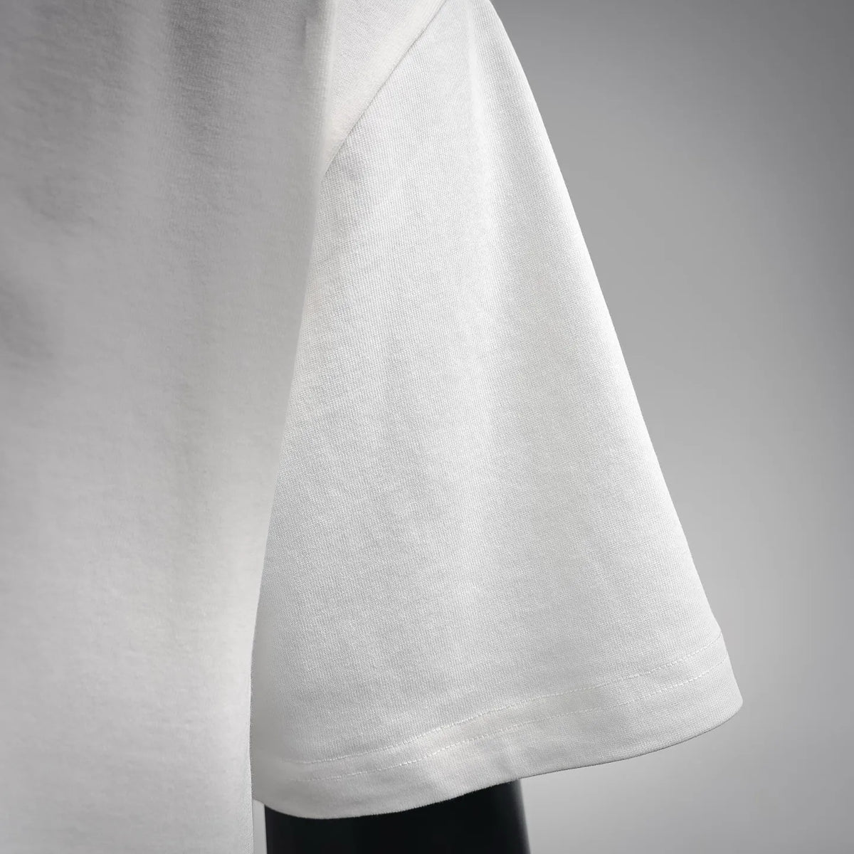 White LOEWE short-sleeve T-shirt hem and side seam detail.