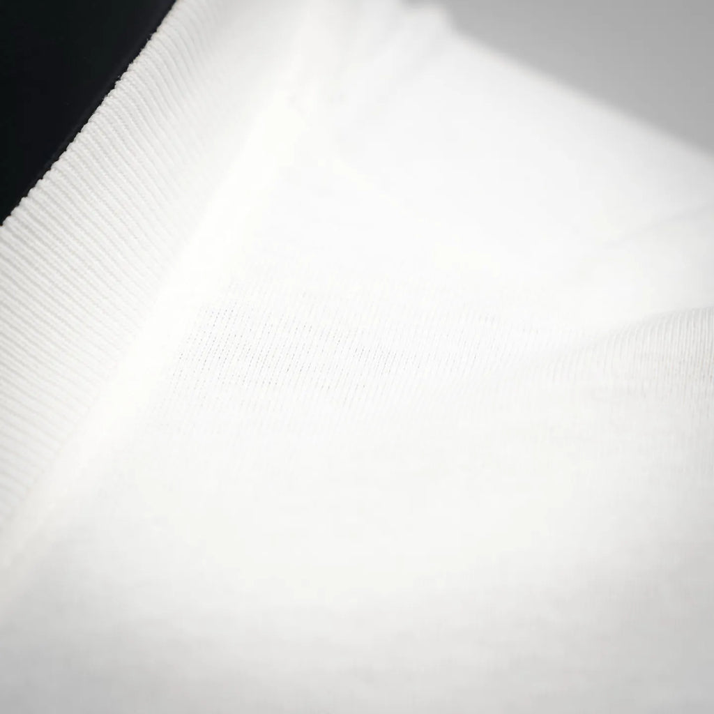 White LOEWE T-shirt knit fabric texture close-up.