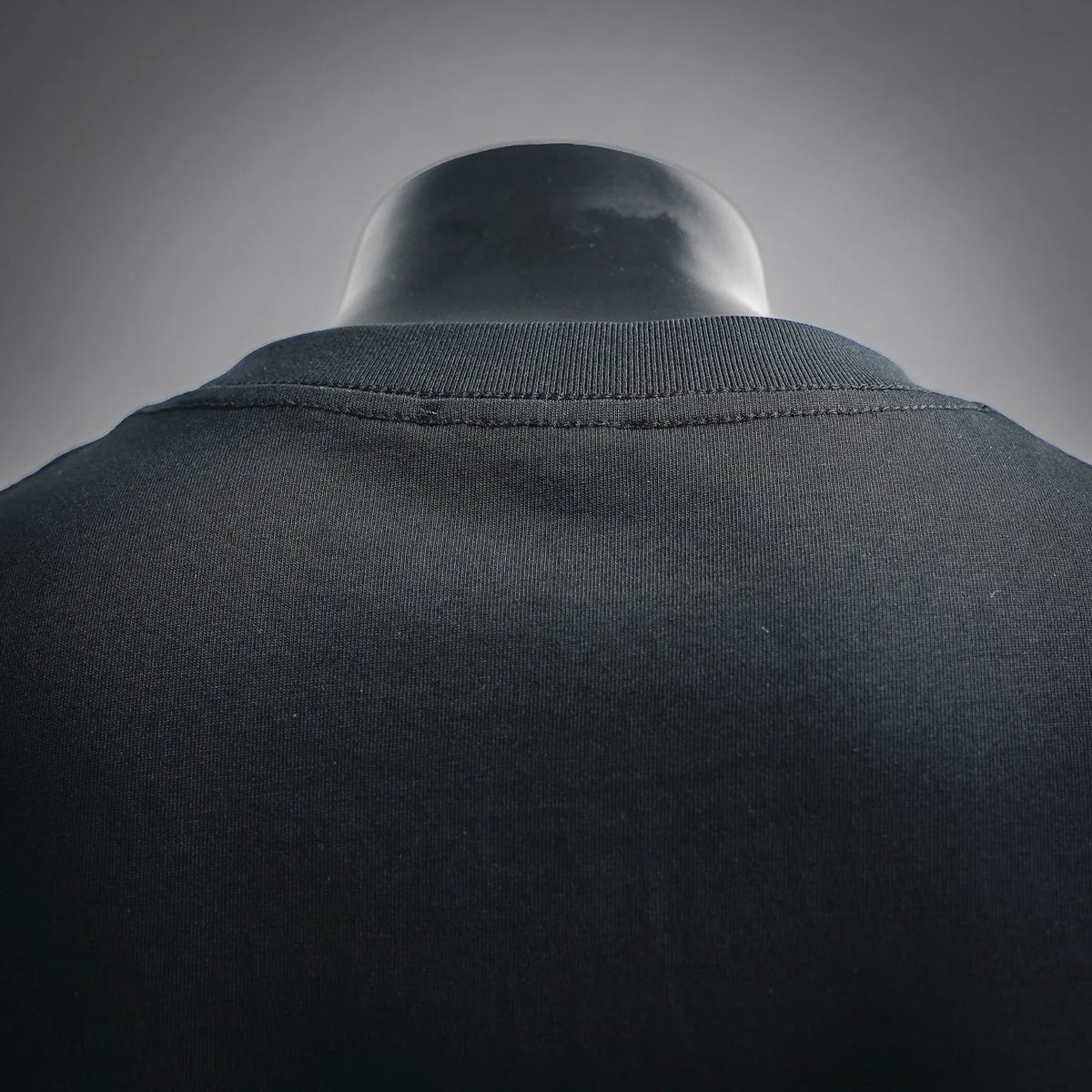 LOEWE crewneck collar detail on dark T-shirt, ribbed knit neckline