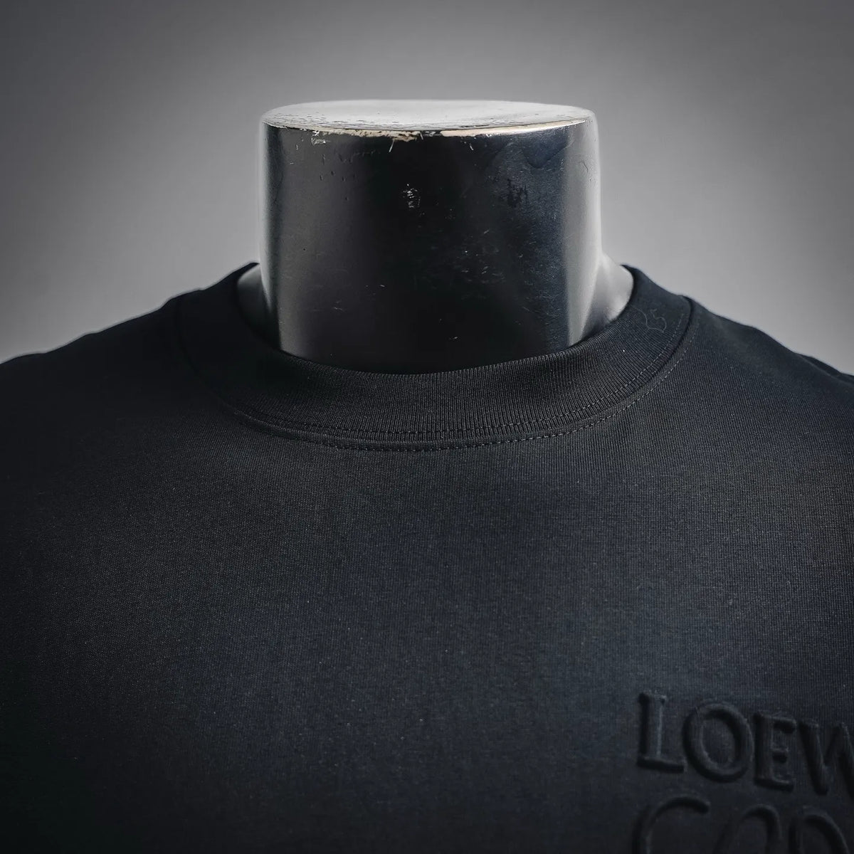 LOEWE crewneck T-shirt neckline and raised chest logo close-up