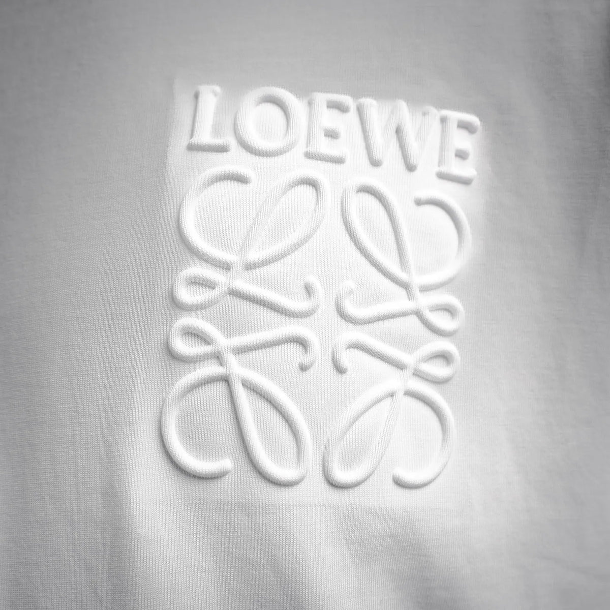 White T-shirt with raised LOEWE logo print on the chest.