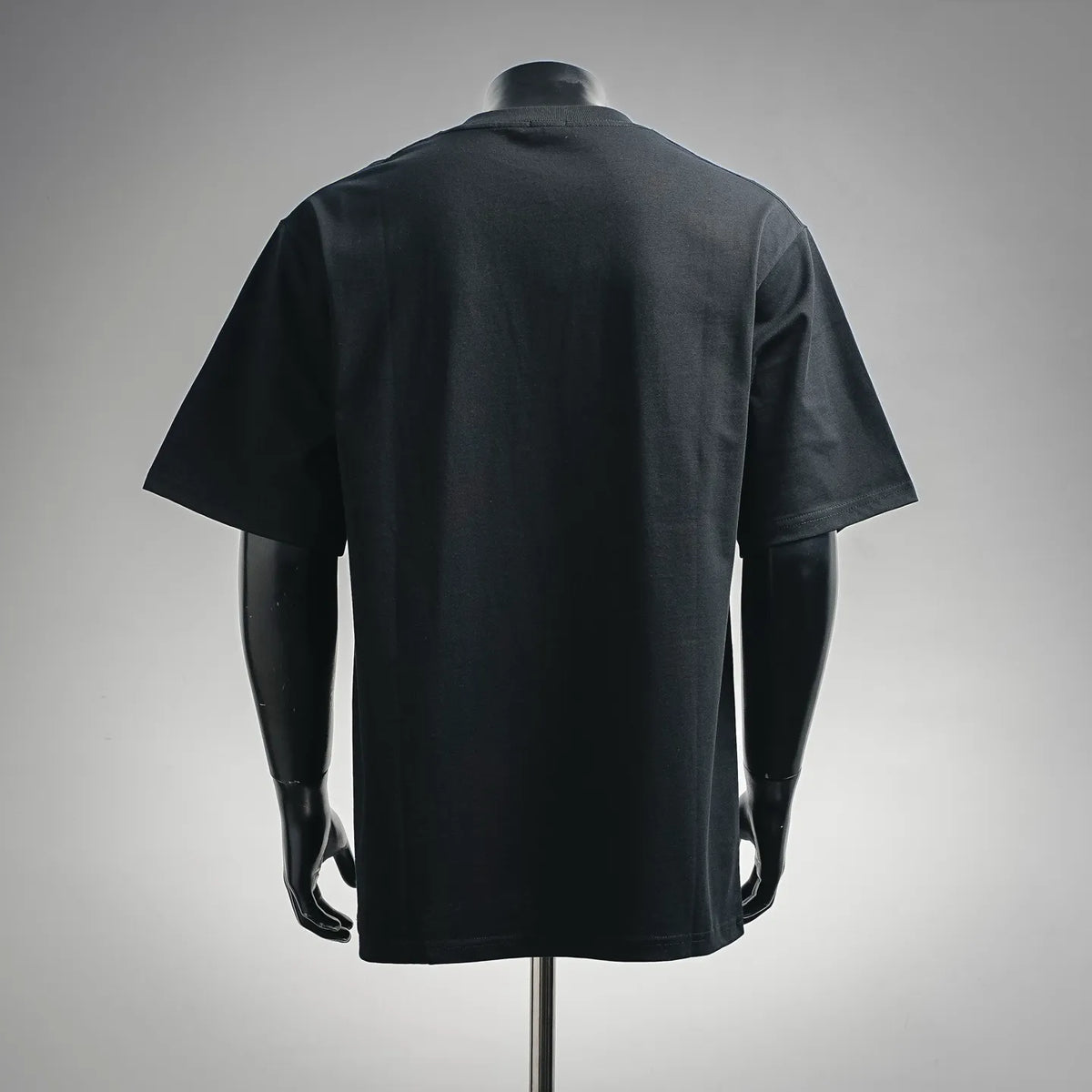 Black crew-neck T-shirt back view on mannequin