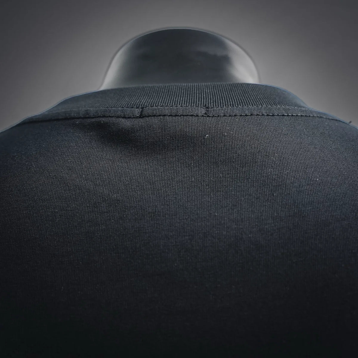 Black T-shirt neckline seam close-up