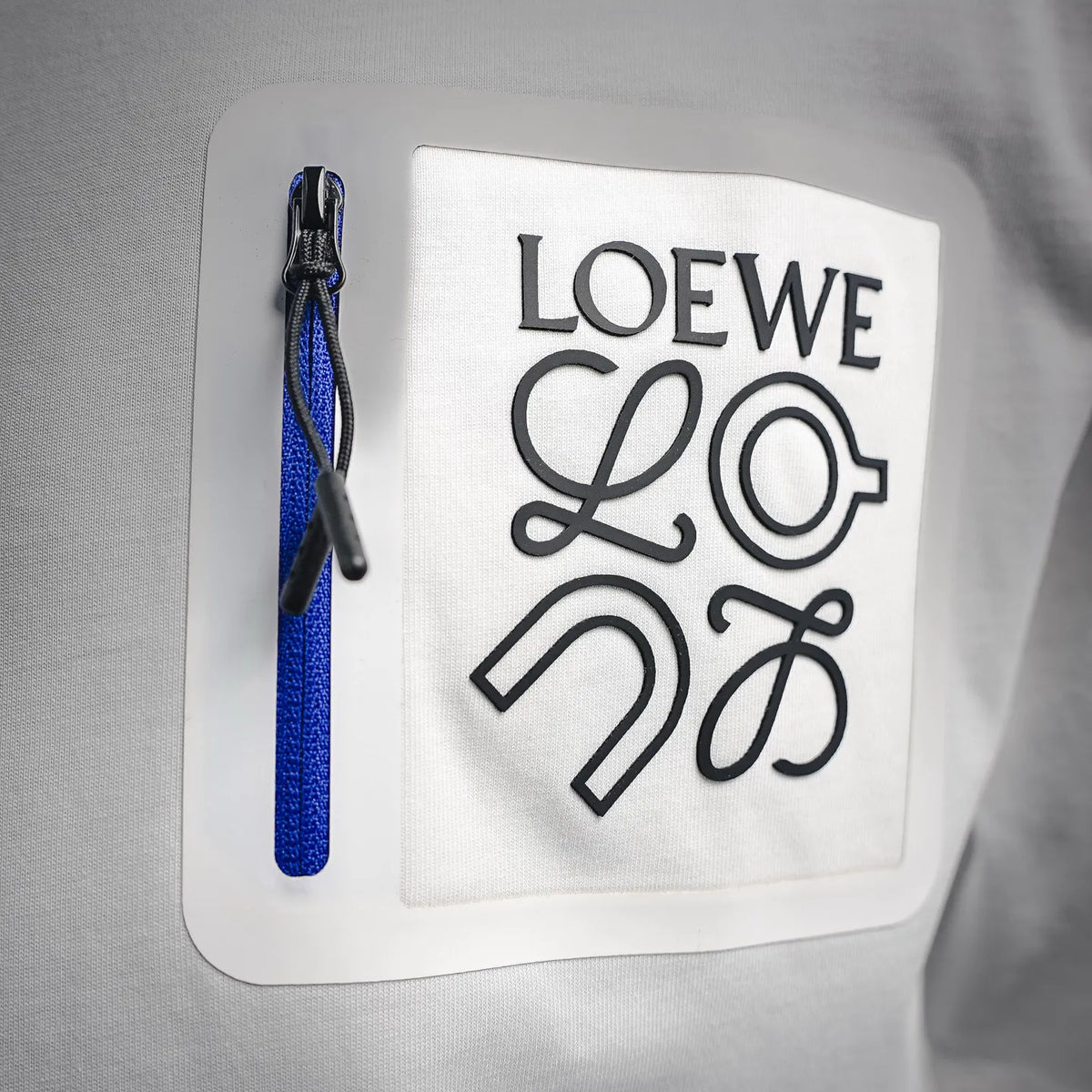 White LOEWE T-shirt with rectangular front logo patch and blue pull-tab