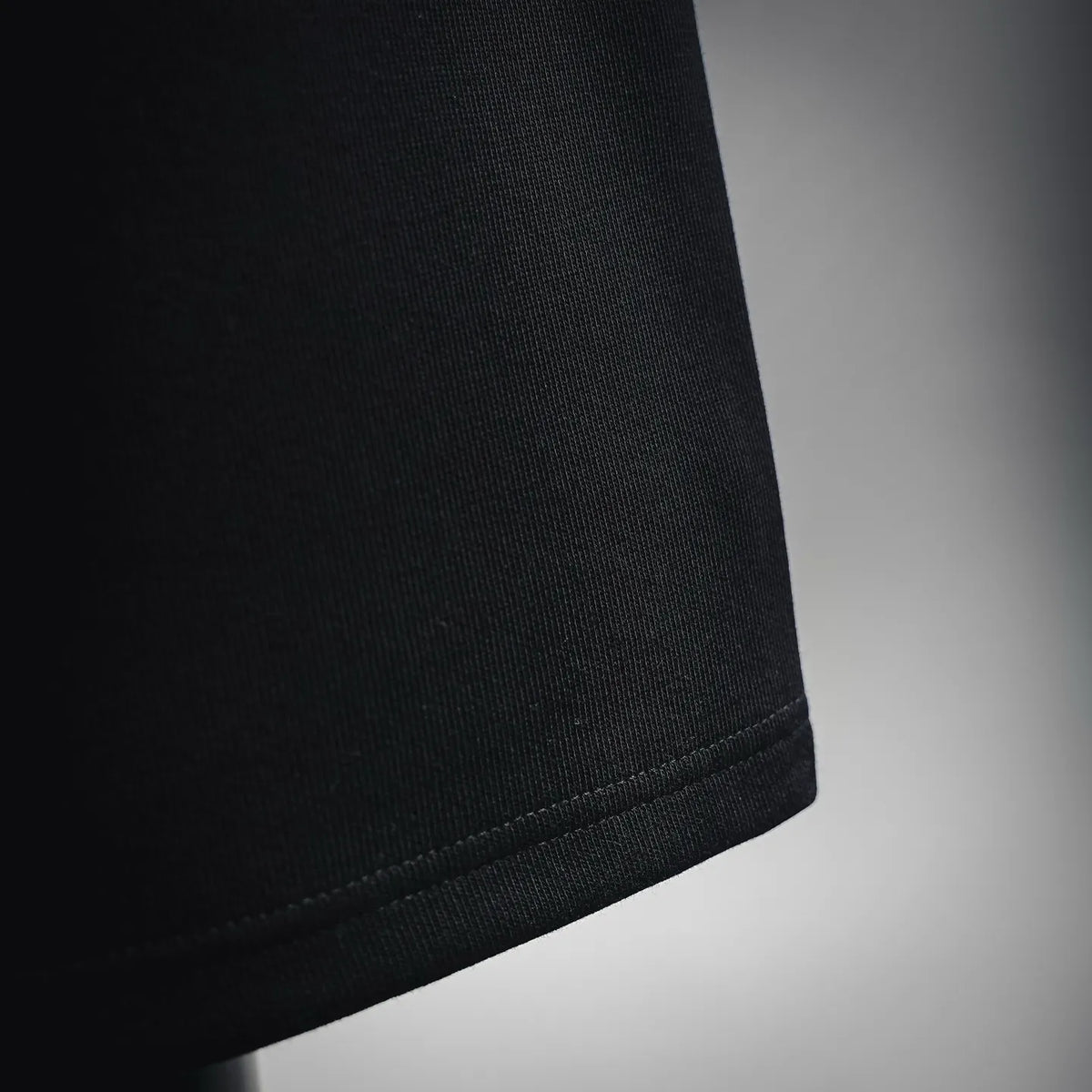 Black shorts hem with stitched cuff detail