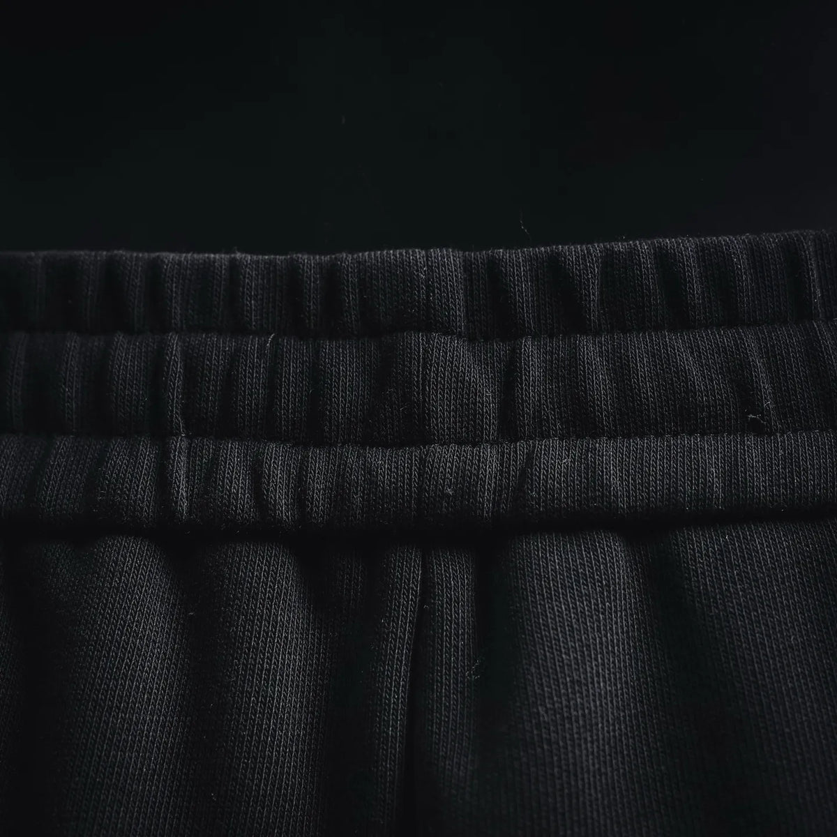 Black shorts waistband with gathered elastic and drawstring channel
