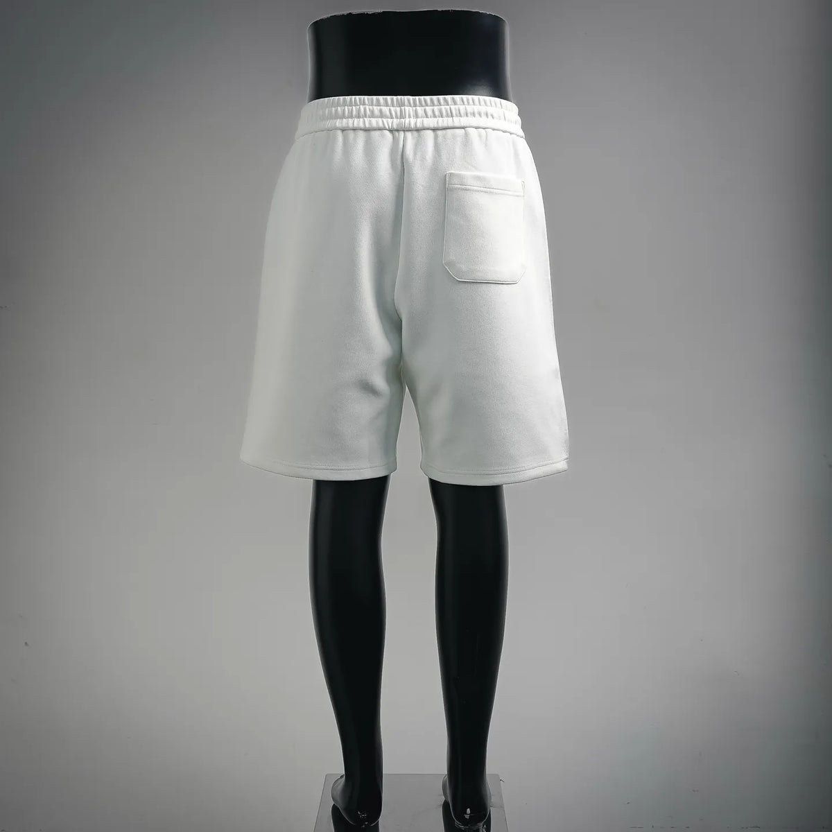 White LOEWE shorts with back patch pocket and elastic waistband