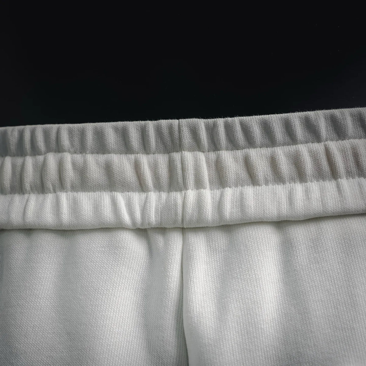 White LOEWE shorts waistband and textured fabric close-up
