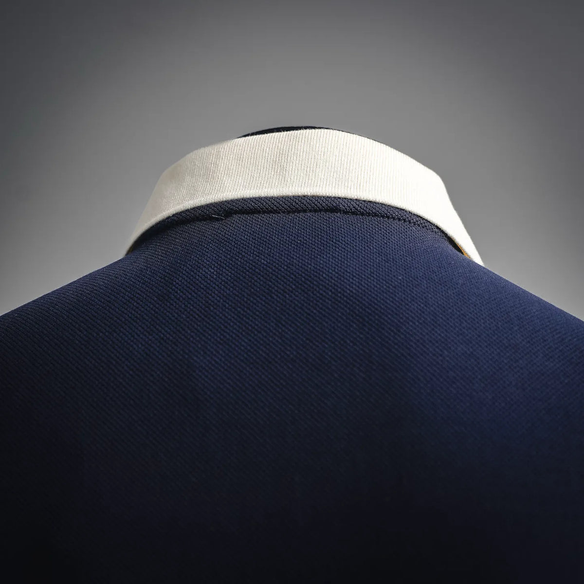 Navy LOEWE polo shirt collar detail with light beige inner trim