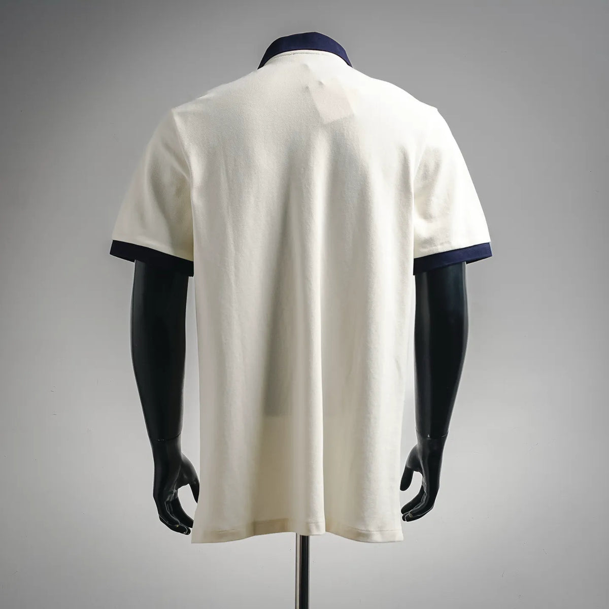 LOEWE short-sleeve polo shirt, white back view with navy collar and sleeve trims