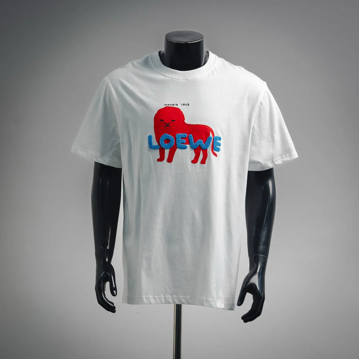 White graphic T-shirt with red and blue dog LOEWE logo on front
