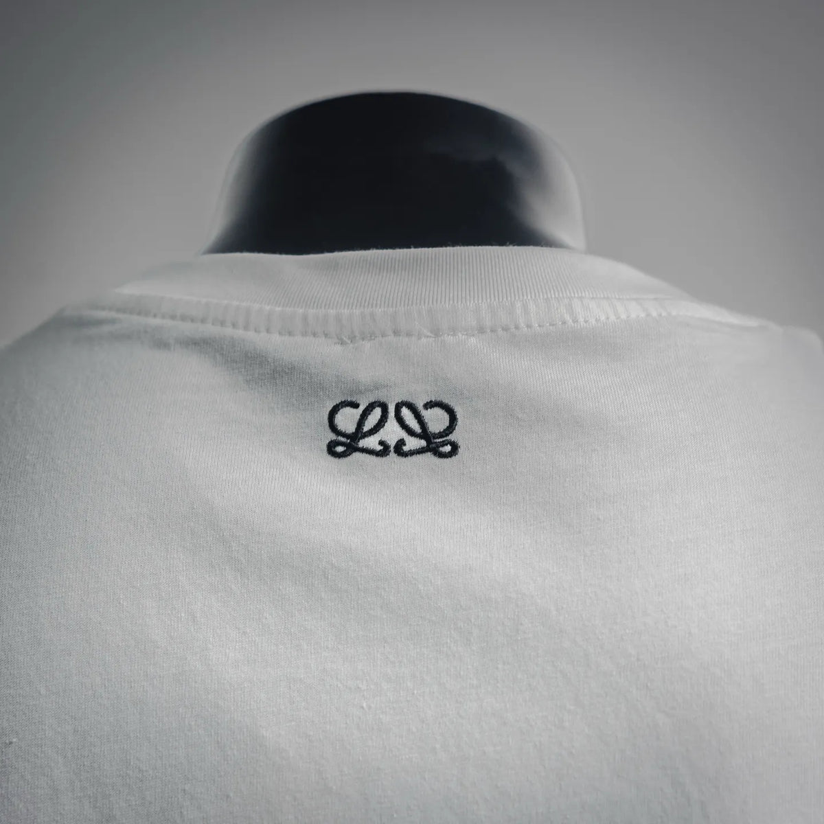 White T-shirt back neck area with small black LOEWE emblem