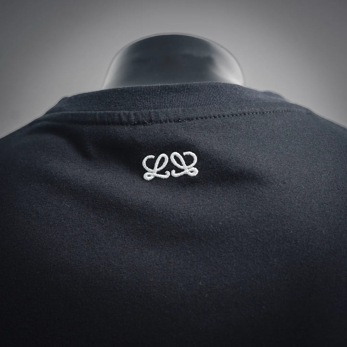 Black LOEWE T-shirt with small white loop logo on the back neck